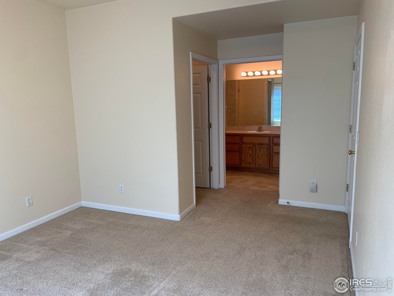 124 Beacon Way, Unit B Windsor, CO 80550 - Photo 9 of 26 a view of an empty room with a fireplace