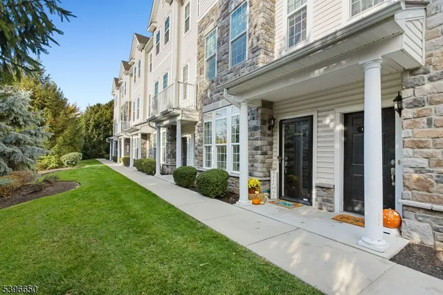 a view of a building with a yard