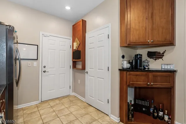 a kitchen with stainless steel appliances a refrigerator and cabinets