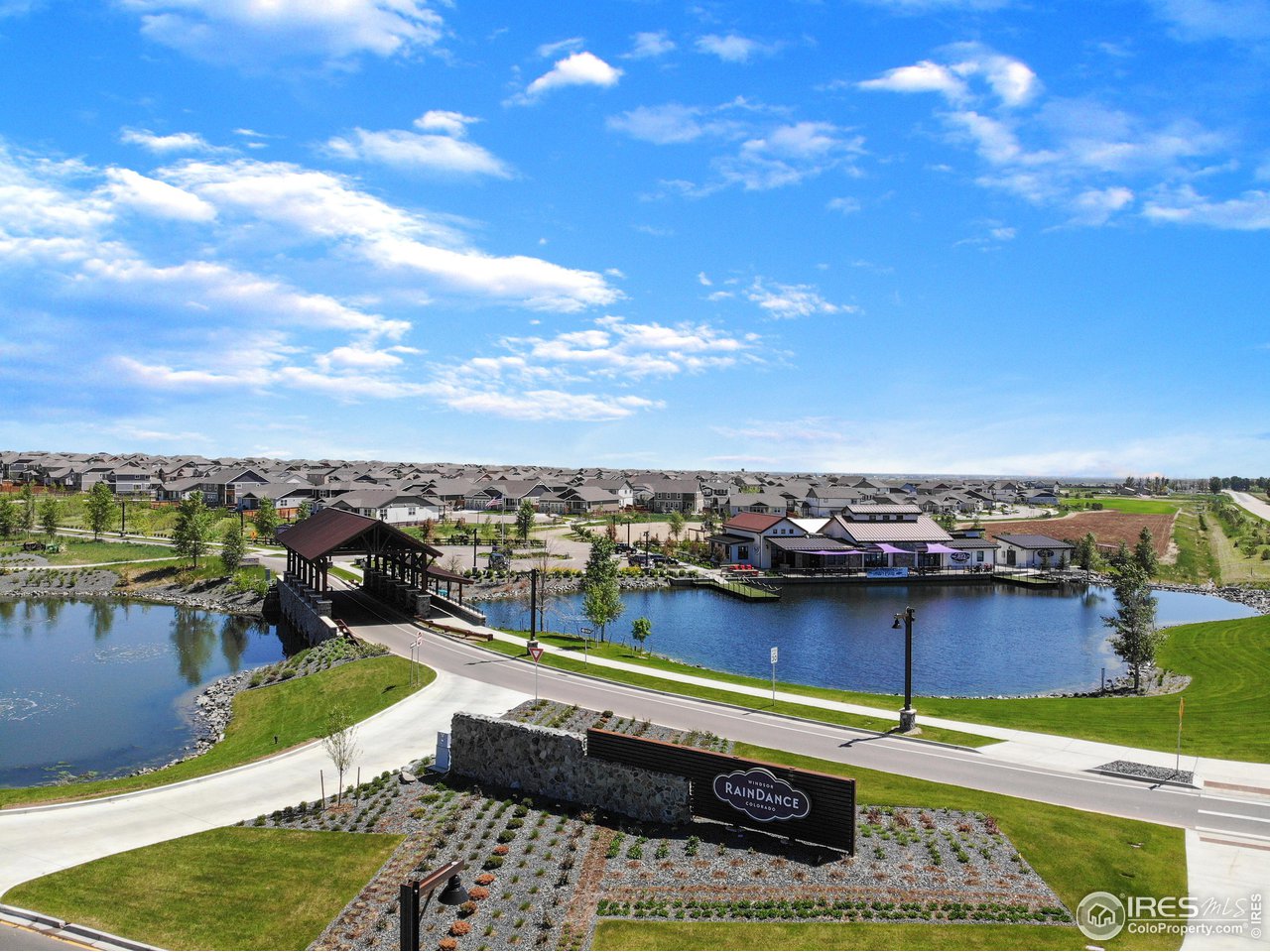 1927 Rolling Wind Drive Windsor, CO 80550 - Photo 28 of 31 a view of a lake with a terrace