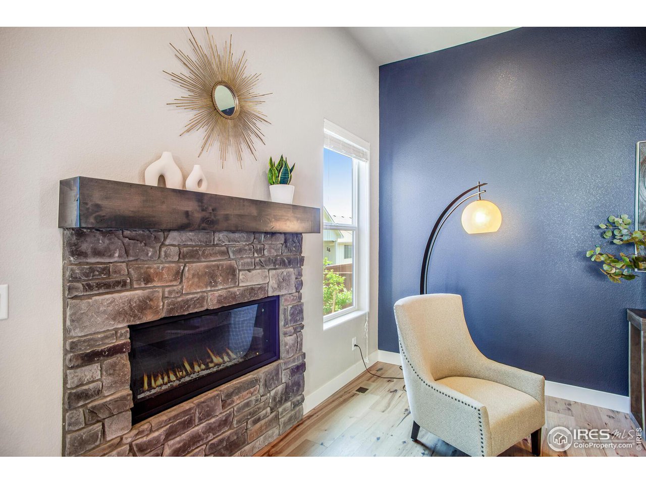 1927 Rolling Wind Drive Windsor, CO 80550 - Photo 6 of 31 a living room with furniture and a fireplace