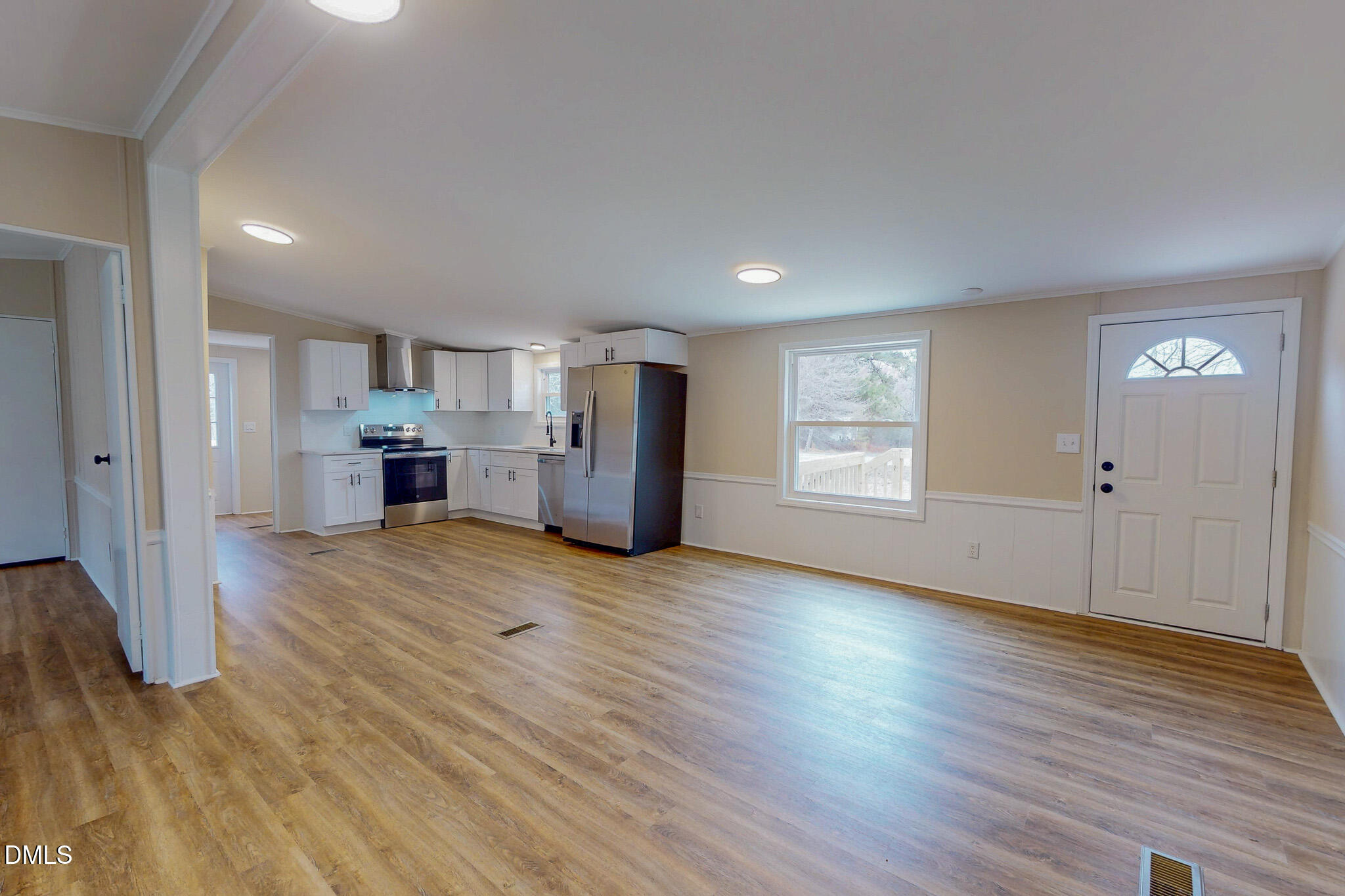 67 Halifax Road Roxboro, NC 27574 - Photo 38 of 48 a view of empty room with a kitchen and wooden floor
