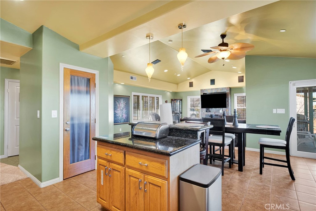32758 Spinel Road Lucerne Valley, CA 92356 - Photo 11 of 40 a view of a dining room with furniture and a chandelier