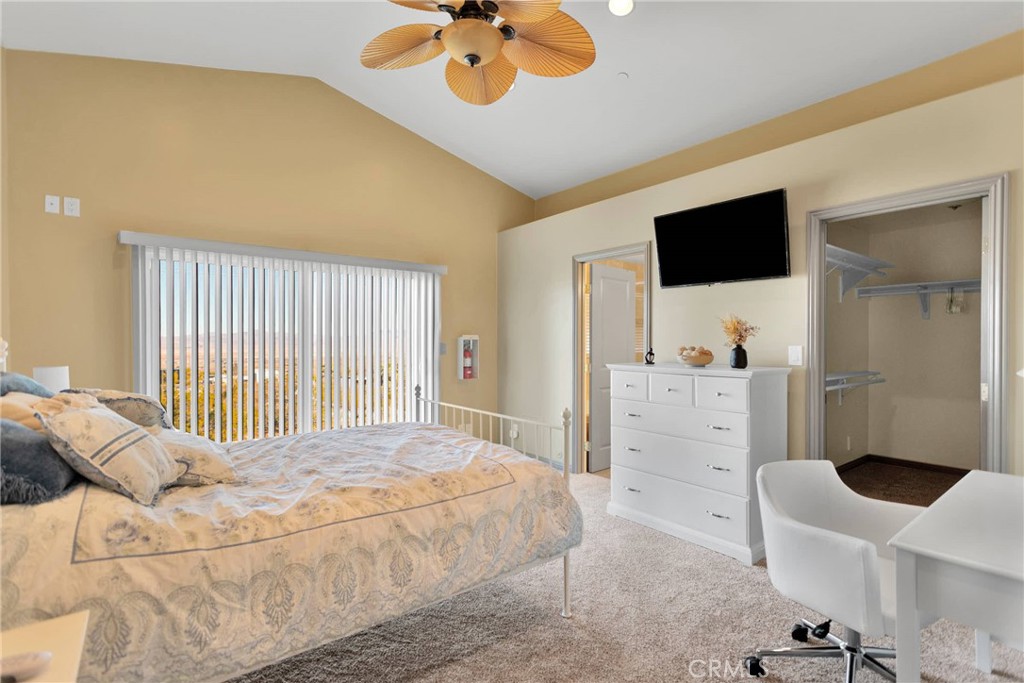 32758 Spinel Road Lucerne Valley, CA 92356 - Photo 16 of 40 a bedroom with a bed a furniture and a large window