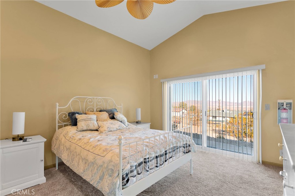 32758 Spinel Road Lucerne Valley, CA 92356 - Photo 17 of 40 a bedroom with a bed and wooden floor