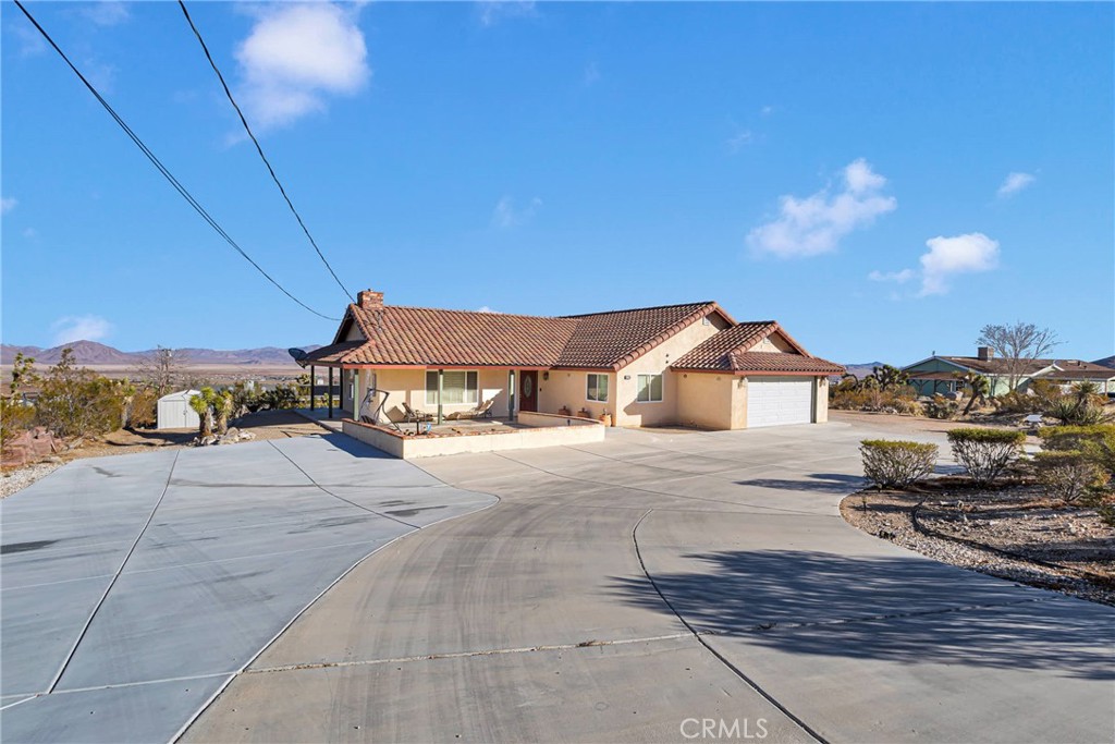 32758 Spinel Road Lucerne Valley, CA 92356 - Photo 2 of 40 a view of a house with a street