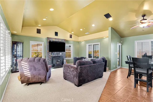 a living room with couches and a flat screen tv