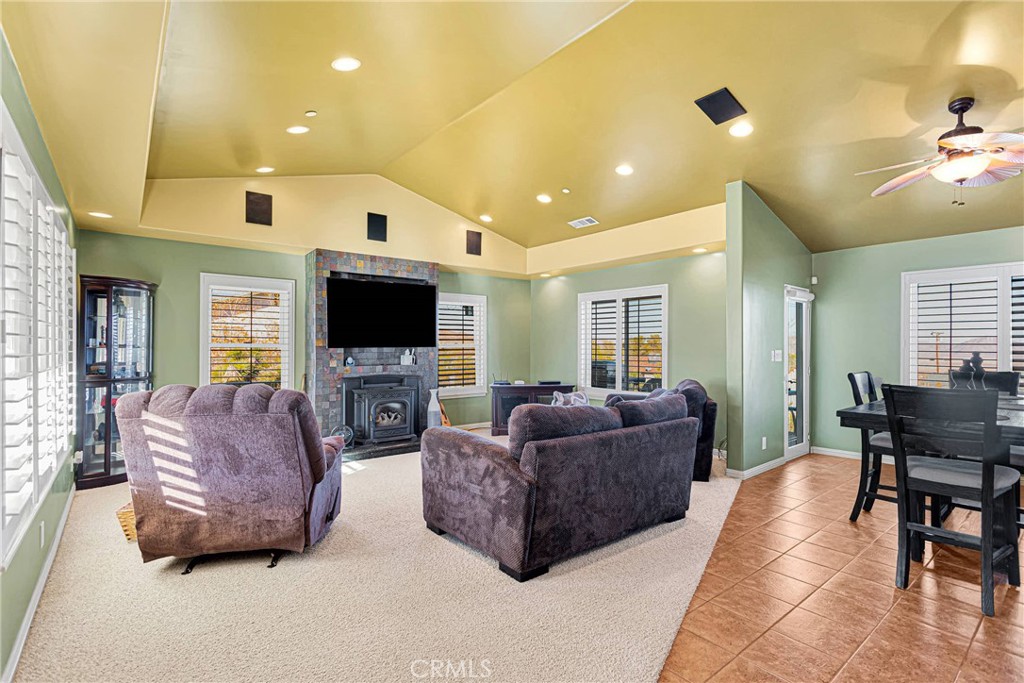 32758 Spinel Road Lucerne Valley, CA 92356 - Photo 4 of 40 a living room with couches and a flat screen tv