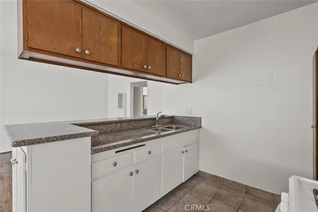 a white stove top oven sitting inside of a kitchen