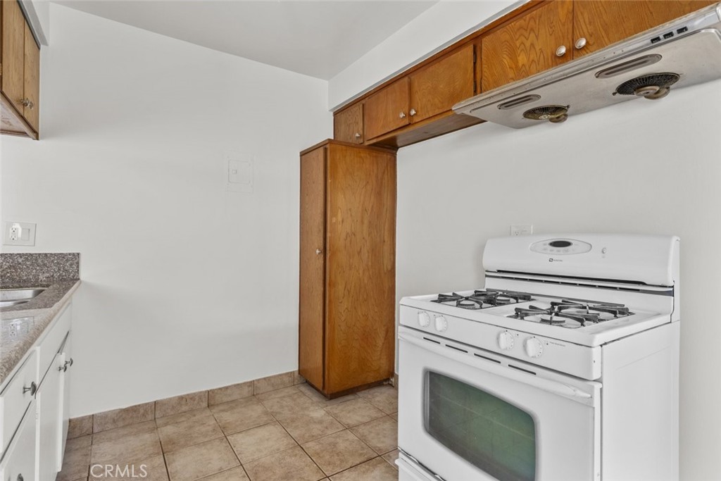1601 College View Drive, Unit 12 Monterey Park, CA 91754 - Photo 14 of 27 a white stove top oven sitting inside of a kitchen