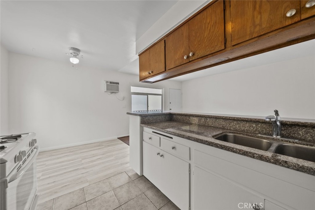 1601 College View Drive, Unit 12 Monterey Park, CA 91754 - Photo 16 of 27 a kitchen with granite countertop cabinets and sink