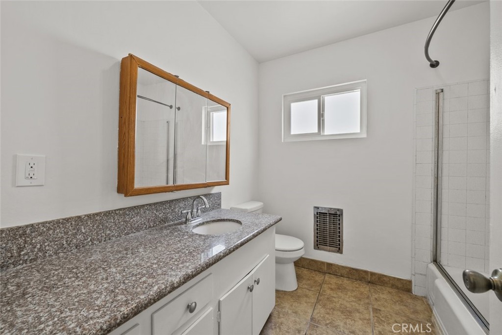 1601 College View Drive, Unit 12 Monterey Park, CA 91754 - Photo 20 of 27 a bathroom with a granite countertop sink and a mirror