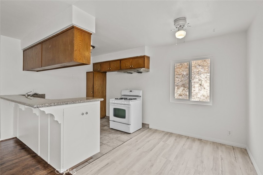 1601 College View Drive, Unit 12 Monterey Park, CA 91754 - Photo 10 of 27 a view of a kitchen with wooden floor and a sink