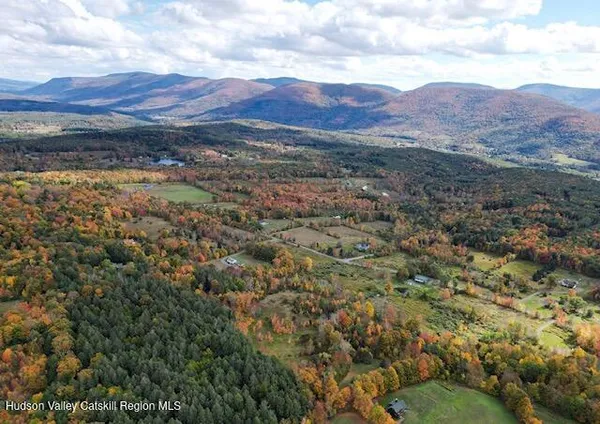 a view of a patio with a table and chairs