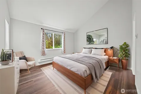 a bedroom with a bed and a couch