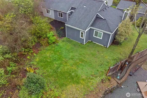 an aerial view of a house with a swimming pool