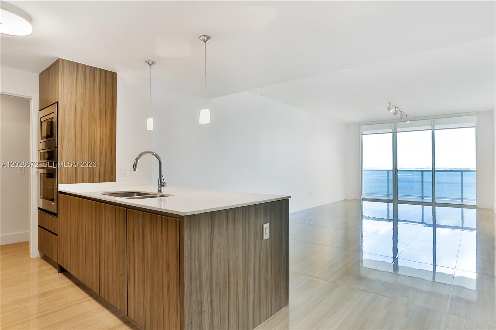 600 Northeast 27th Street, Unit 1504 Miami, FL 33137 - Photo 2 of 20 OPEN KITCHEN & LIVING ROOM