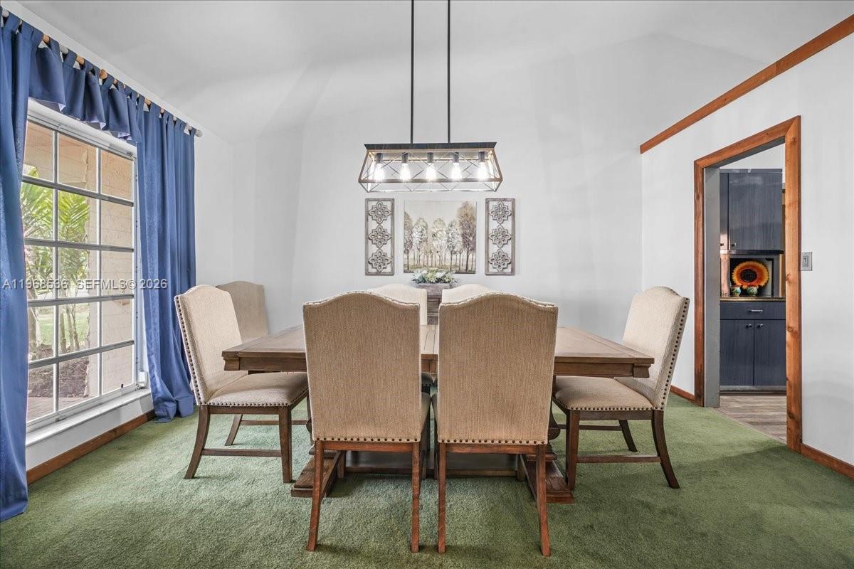 17490 Southwest 288th Street Homestead, FL 33030 - Photo 21 of 80 a view of a dining room with furniture window and outside view