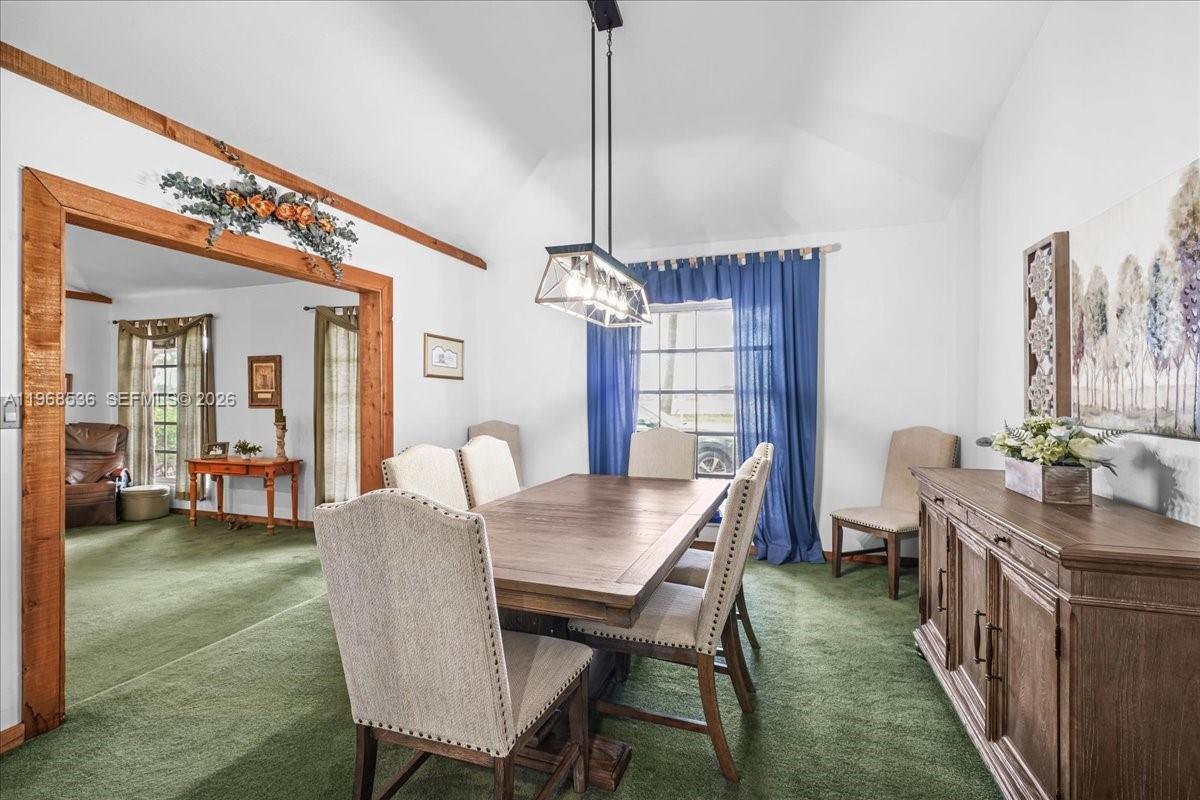 17490 Southwest 288th Street Homestead, FL 33030 - Photo 37 of 80 a view of a dining room with furniture window and wooden floor