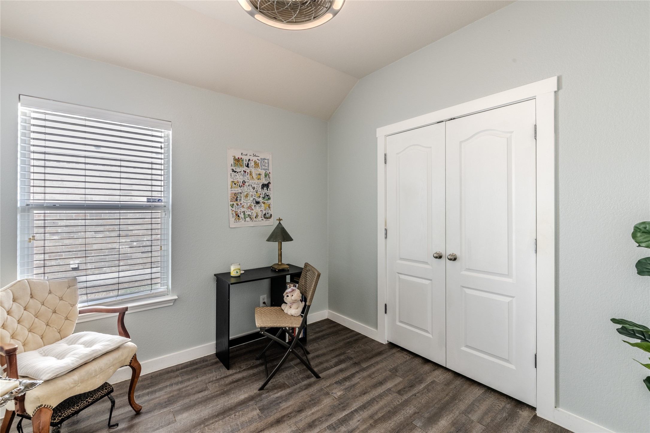 1089 Hot Spring Valley Buda, TX 78610 - Photo 15 of 26 Double doors and handsome wood-look flooring define this versatile secondary bedroom space.