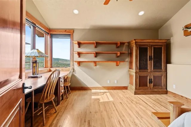 a bedroom with furniture and a window