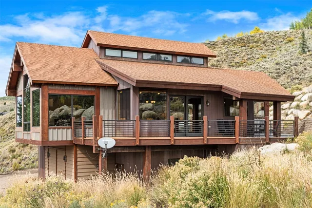 a view of a house with a iron fence