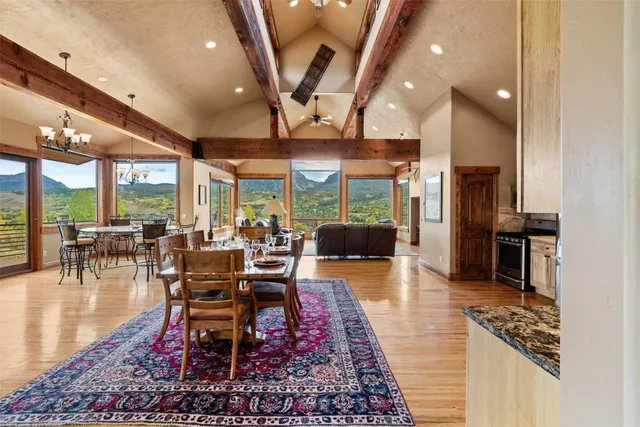 a outdoor space with lots of tables a large window and chairs