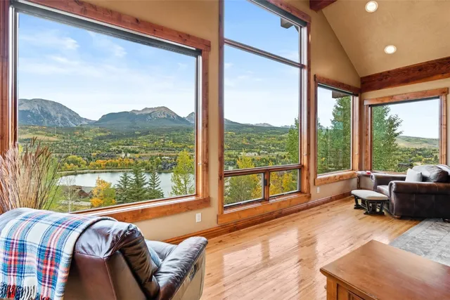 a bedroom with furniture and a large window