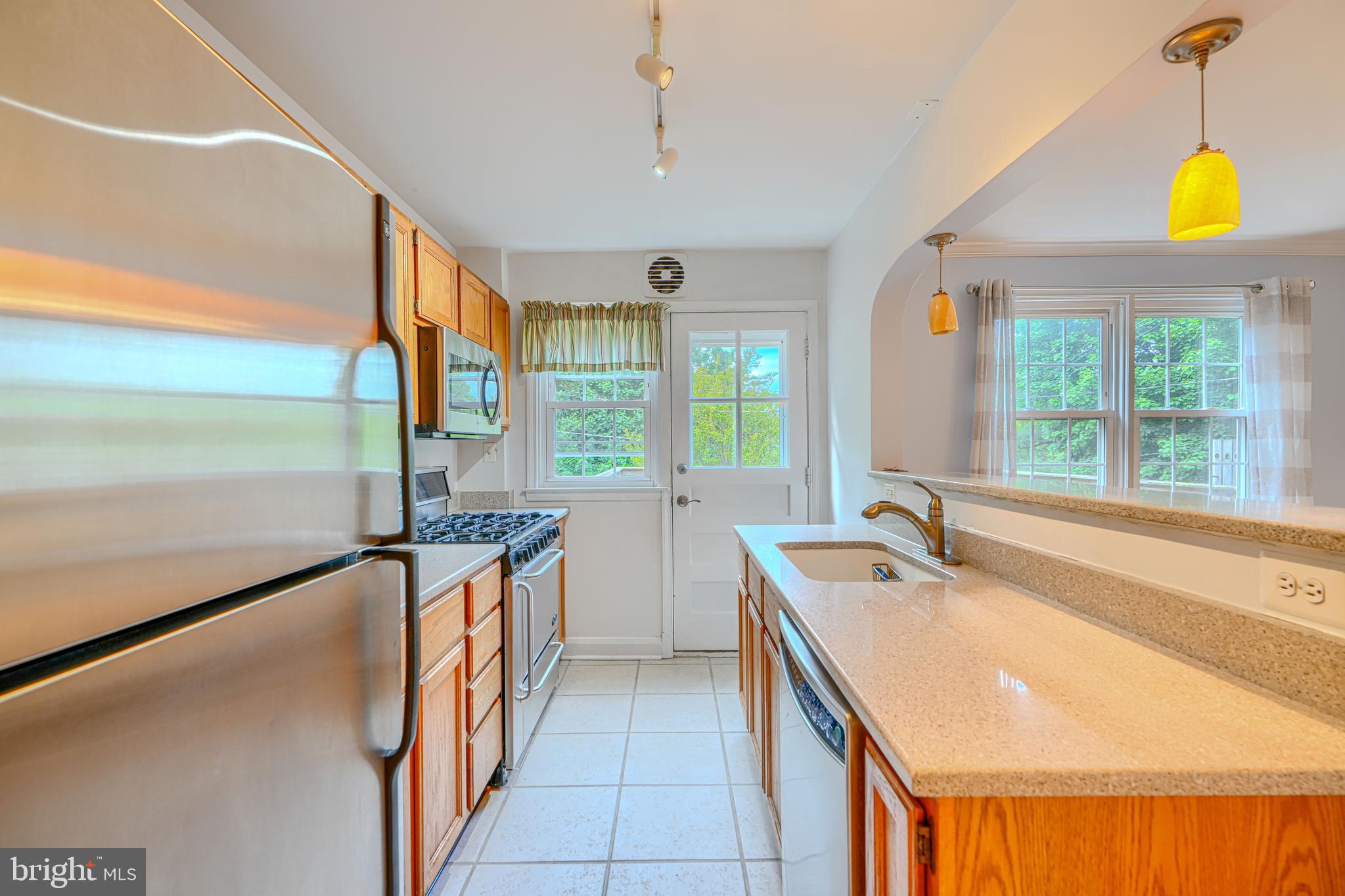 372 Old Trail Baltimore, MD 21212 - Photo 11 of 46 a bathroom with a granite countertop sink and a large window