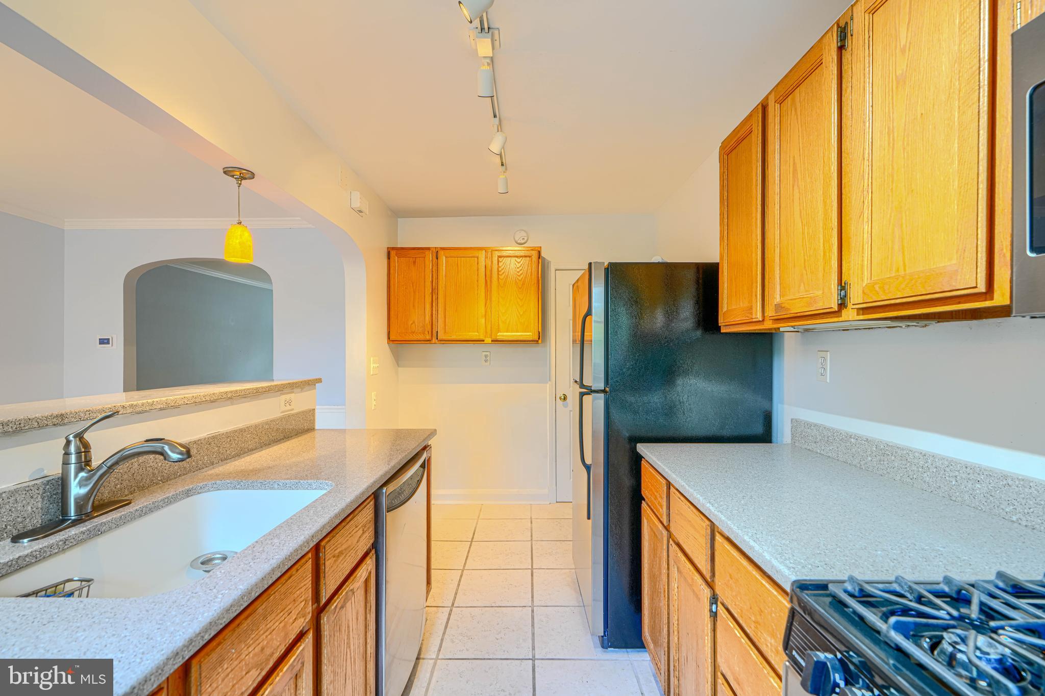 372 Old Trail Baltimore, MD 21212 - Photo 13 of 46 a kitchen with stainless steel appliances granite countertop a sink and a refrigerator