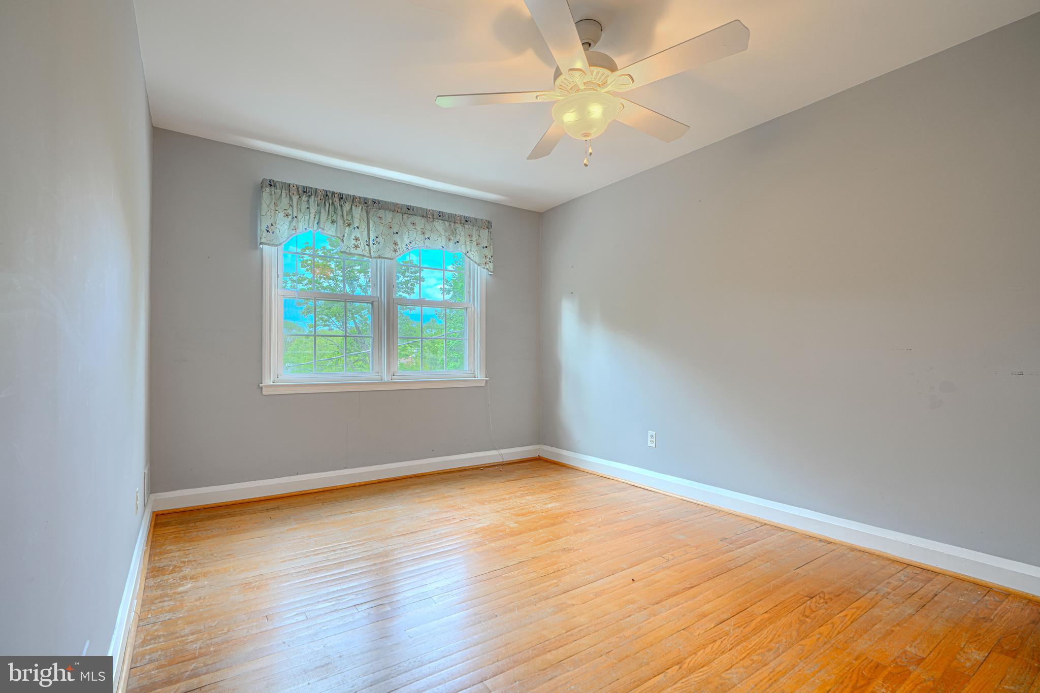 372 Old Trail Baltimore, MD 21212 - Photo 18 of 46 an empty room with a window and a fan