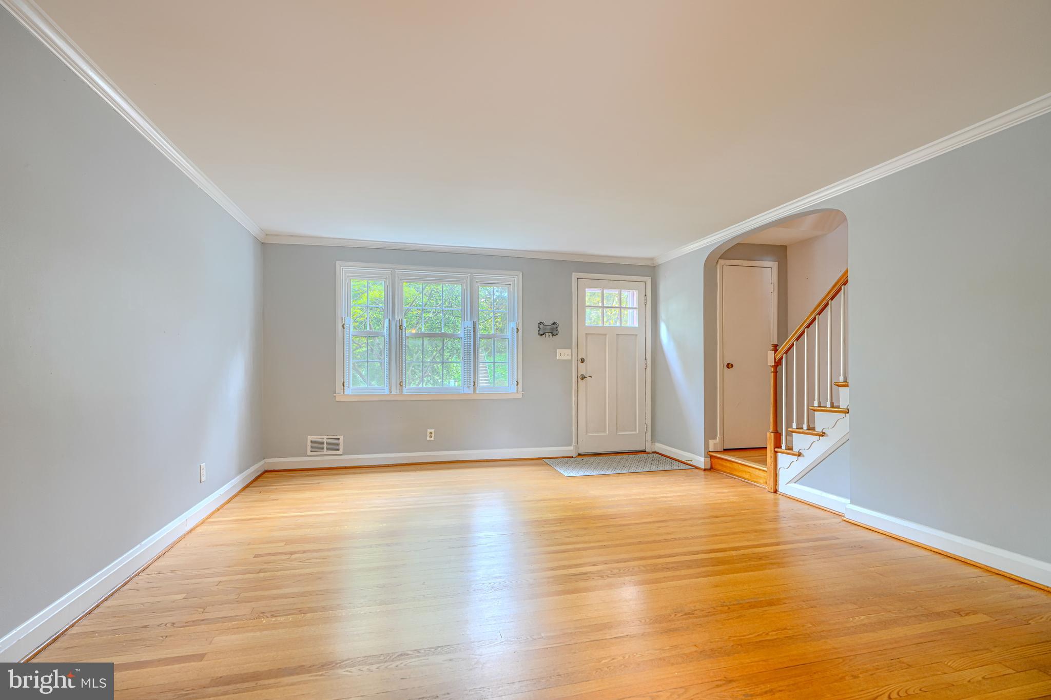 372 Old Trail Baltimore, MD 21212 - Photo 6 of 46 a view of an empty room with wooden floor and a window