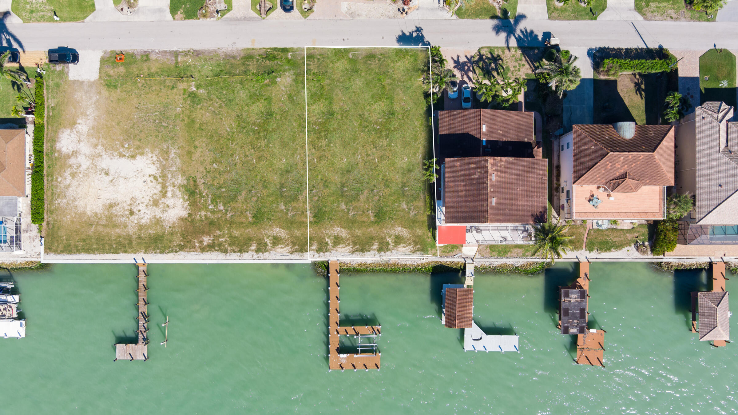 14 East Pelican Street Naples, FL 34113 - Photo 12 of 15 an aerial view of a house with pool yard and outdoor seating