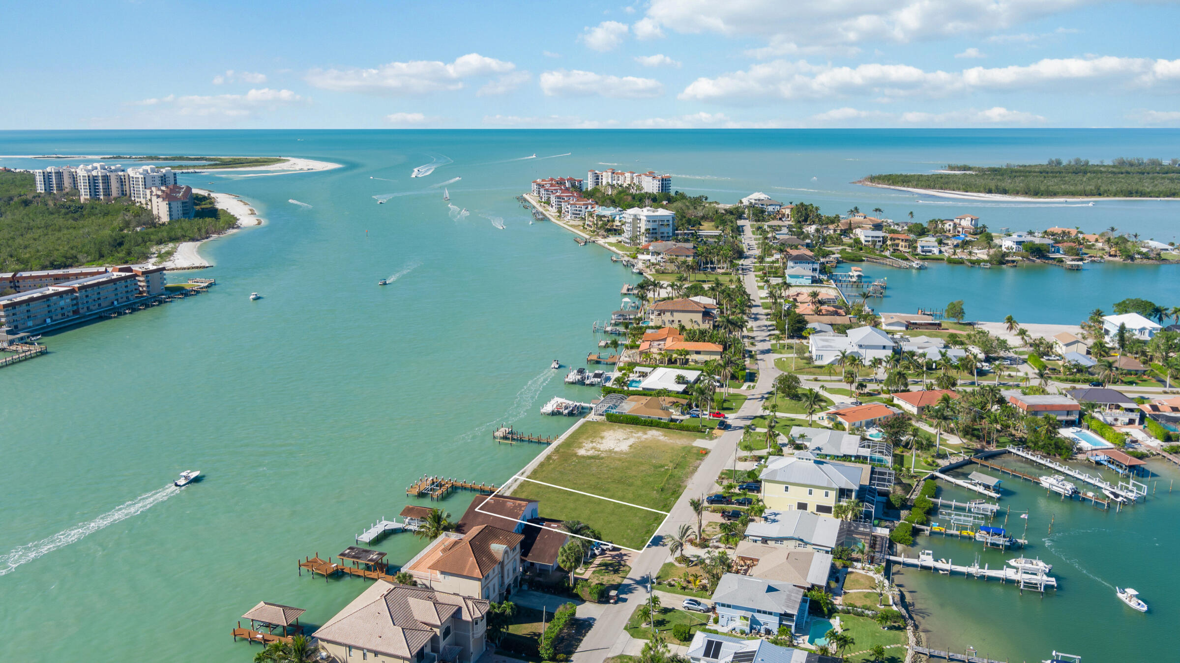 14 East Pelican Street Naples, FL 34113 - Photo 2 of 15 an aerial view of a houses with a lake view