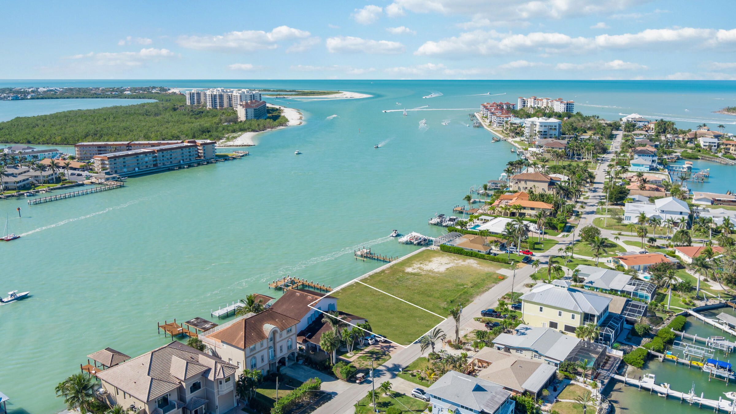14 East Pelican Street Naples, FL 34113 - Photo 3 of 15 an aerial view of a houses with a lake view