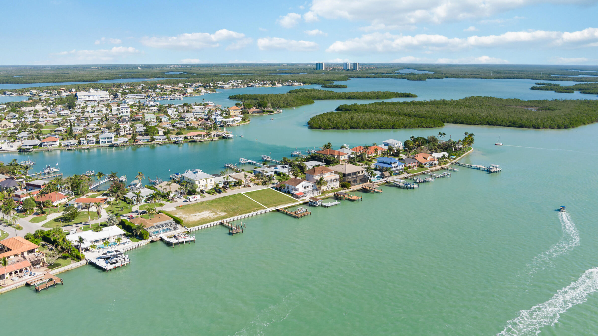 14 East Pelican Street Naples, FL 34113 - Photo 6 of 15 an aerial view of a house with a lake view