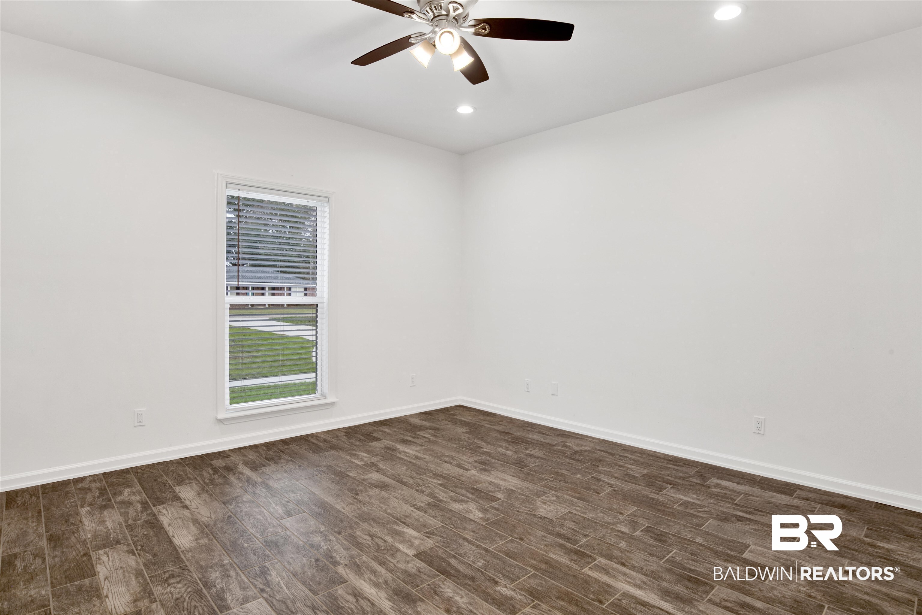10871 Somerset Road Grand Bay, AL 36541 - Photo 18 of 31 Empty room featuring ceiling fan and dark hardwood / wood-style flooring