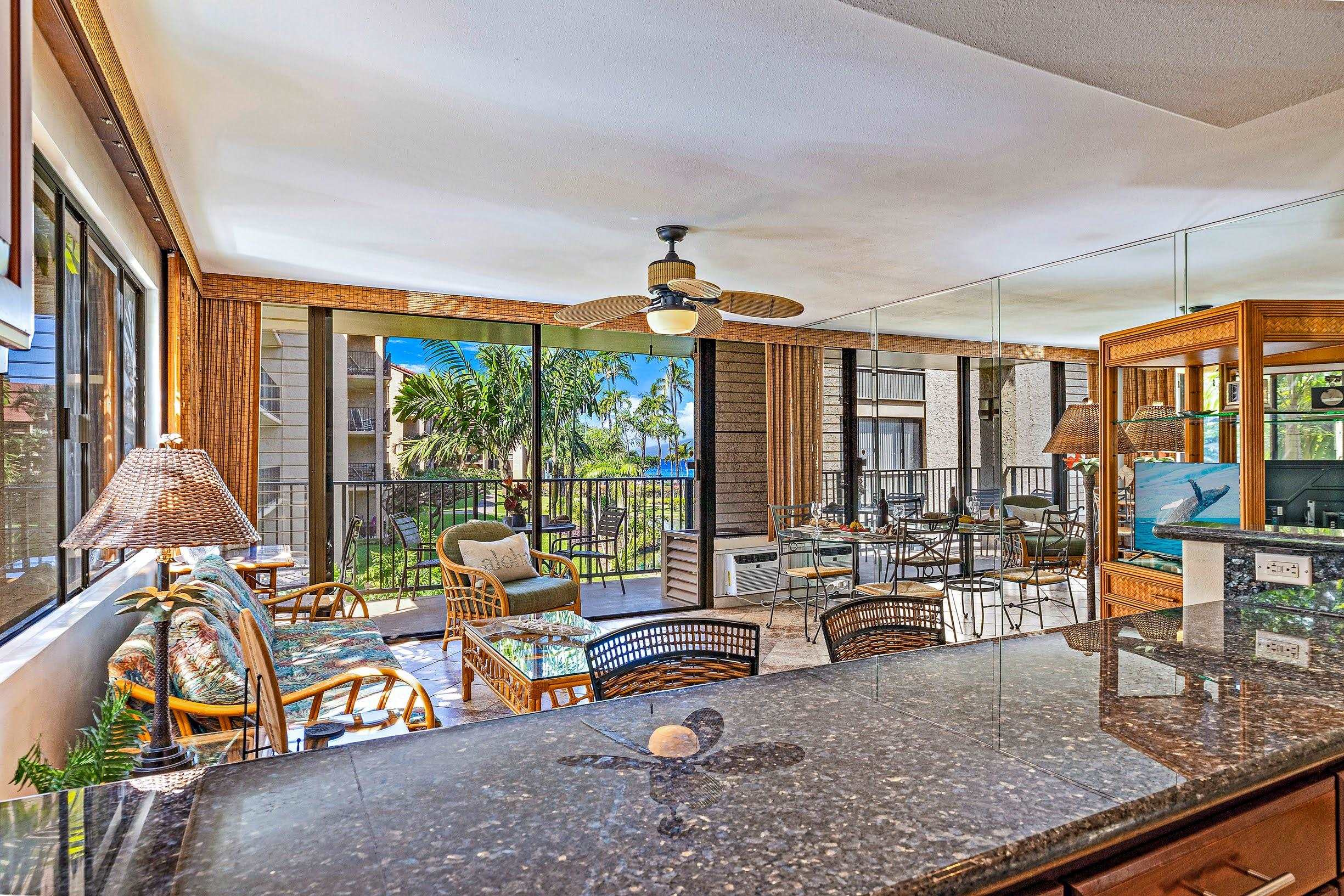 3543 Lower Honoapiilani Road, Unit H201 Lahaina, HI 96761 - Photo 13 of 31 a view of living room filled with furniture and floor to ceiling window