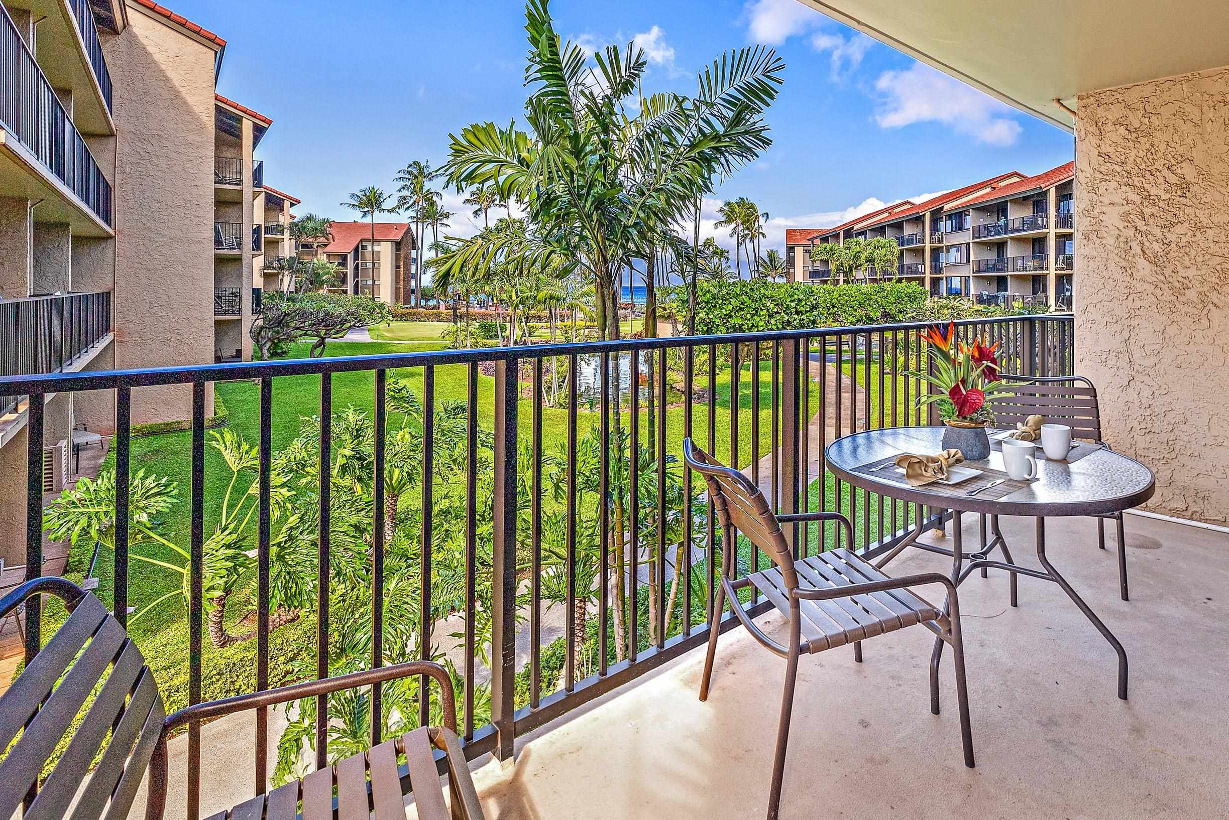 3543 Lower Honoapiilani Road, Unit H201 Lahaina, HI 96761 - Photo 25 of 31 a view of a balcony with a table and chairs