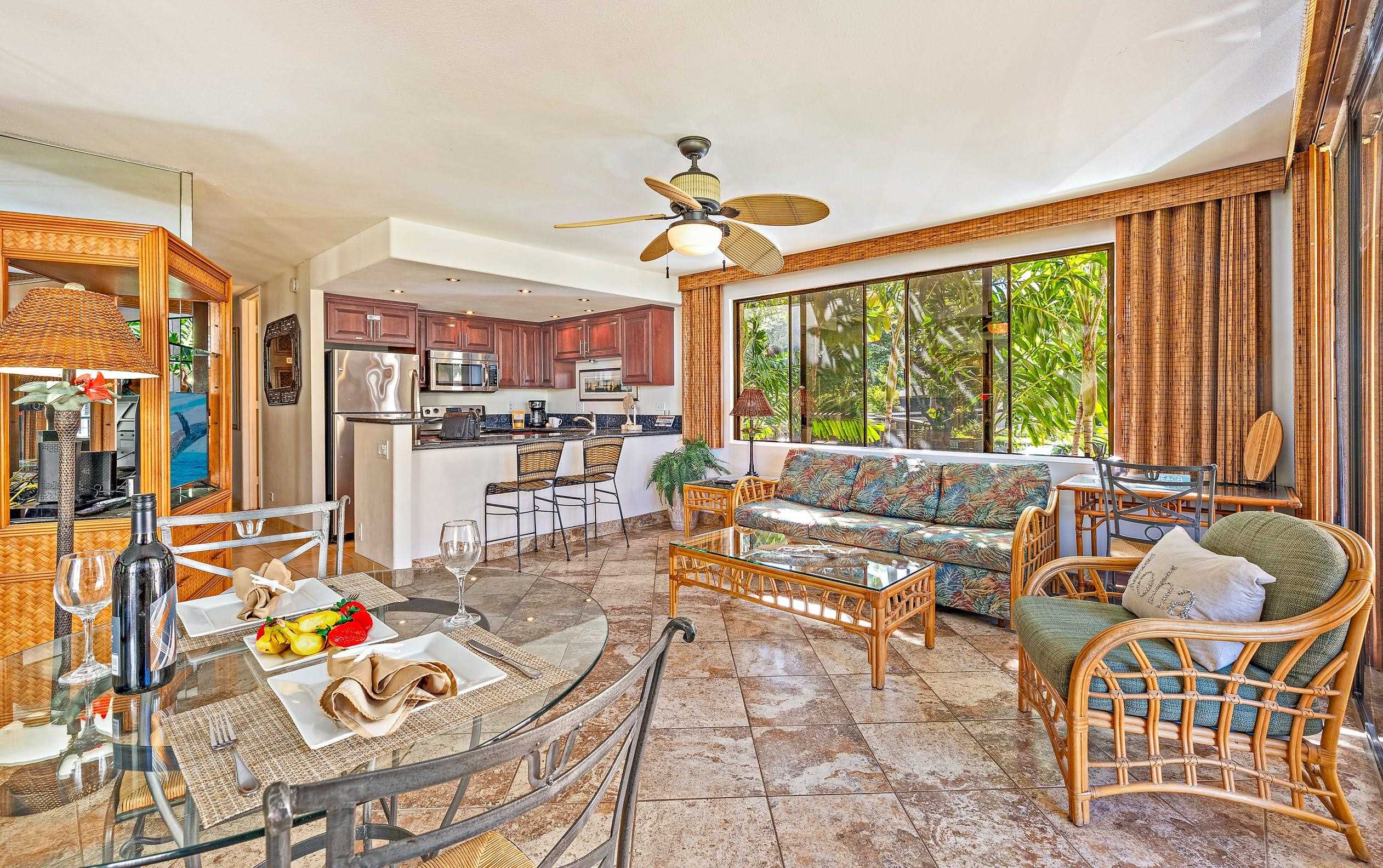 3543 Lower Honoapiilani Road, Unit H201 Lahaina, HI 96761 - Photo 8 of 31 a living room with furniture and a large window