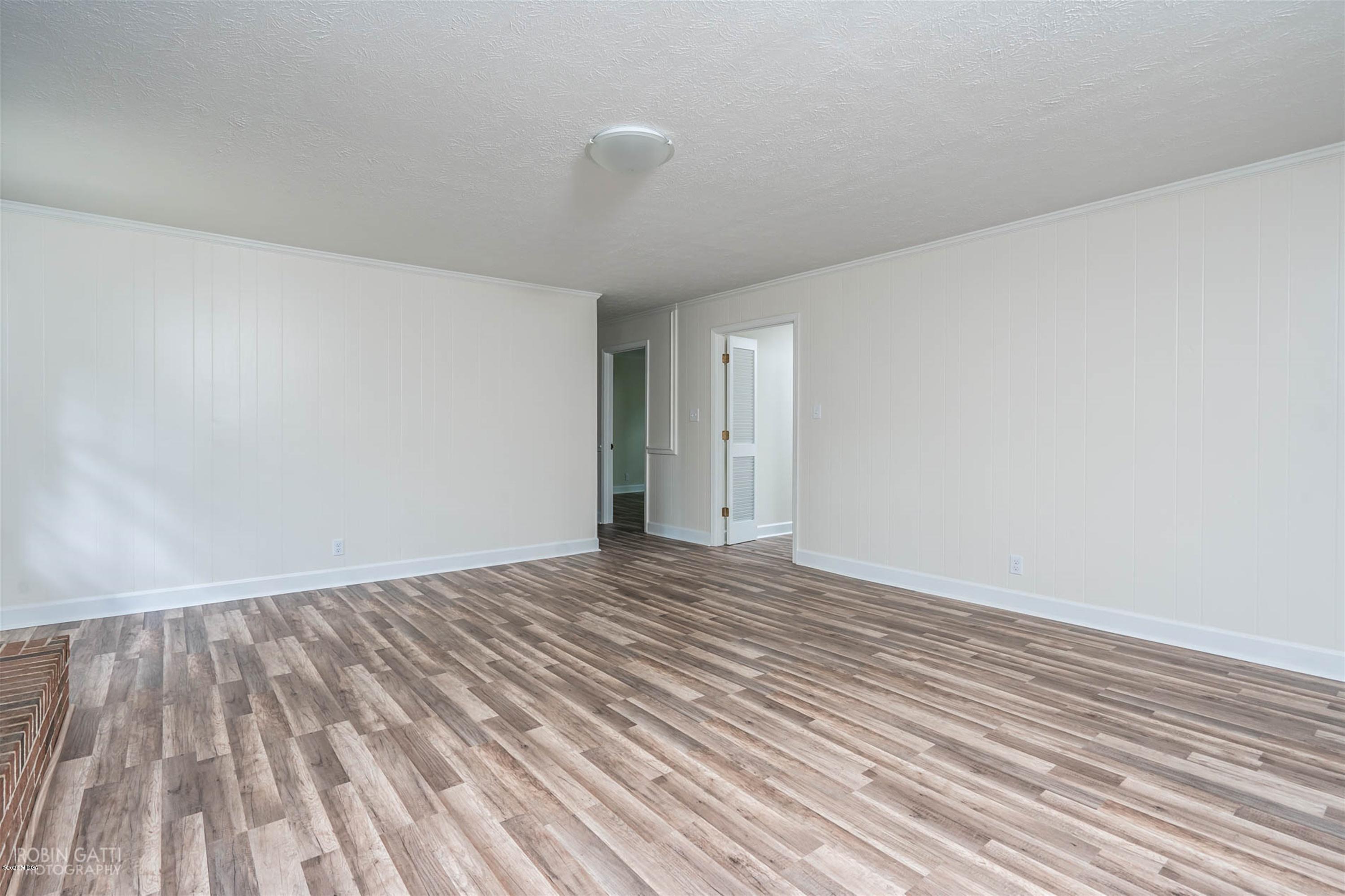 5435 Riverside Drive Macon, GA 31210 - Photo 14 of 34 a view of an empty room with wooden floor
