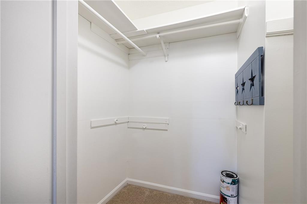 7750 Roswell Road, Unit 9G Sandy Springs, GA 30350 - Photo 12 of 18 a view of walk in closet with clothes