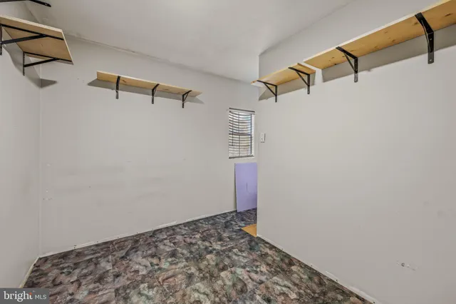 a view of small space with racks on the wall