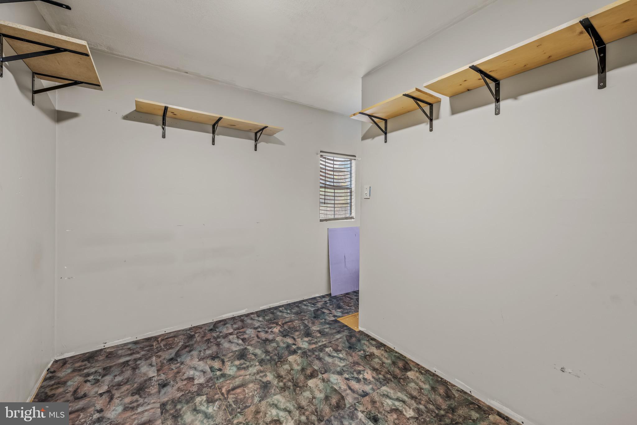 393 Ridersville Road Berkeley Springs, WV 25411 - Photo 12 of 32 a view of small space with racks on the wall