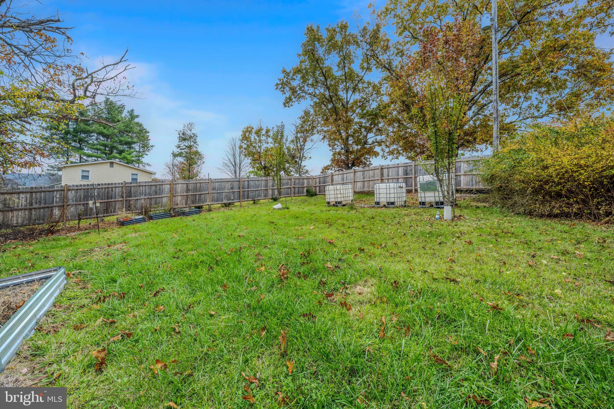 393 Ridersville Road Berkeley Springs, WV 25411 - Photo 18 of 32 a view of a yard with a house in the background