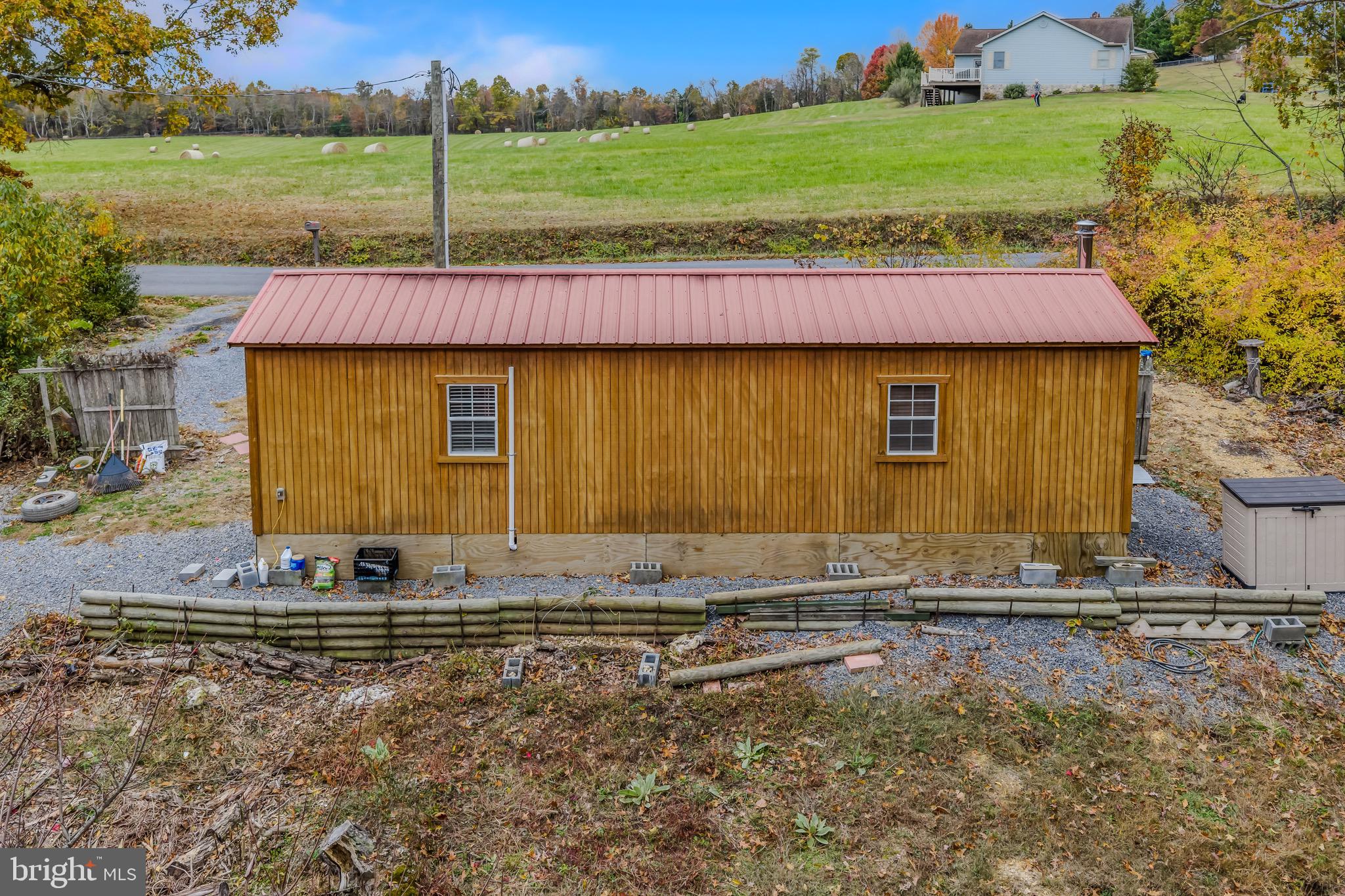 393 Ridersville Road Berkeley Springs, WV 25411 - Photo 20 of 32 a view of a house with backyard and garden
