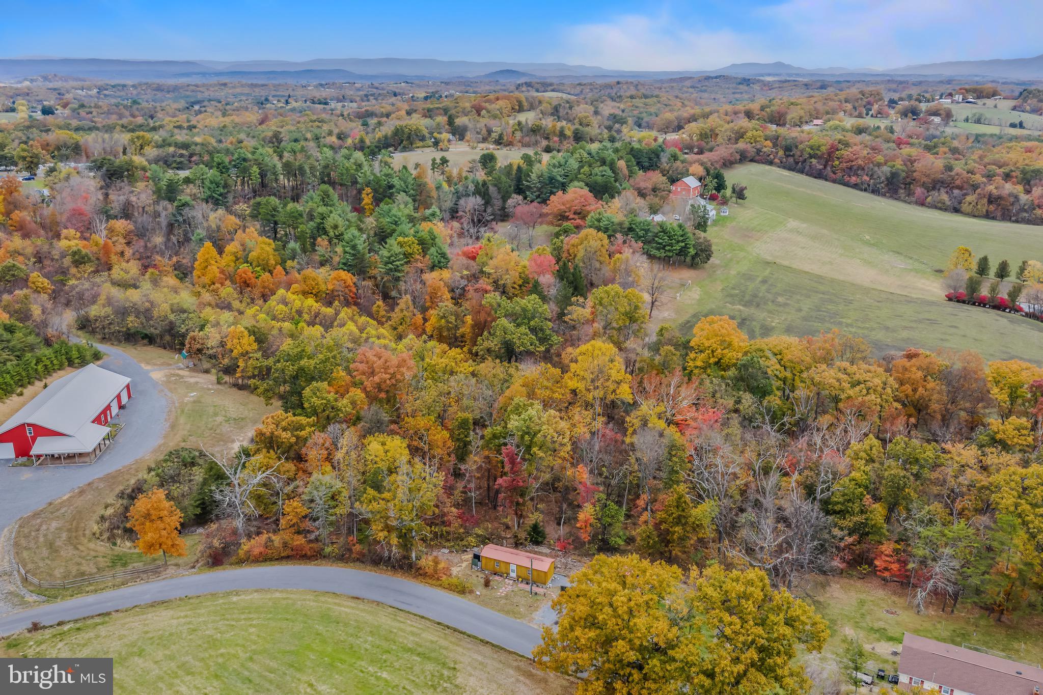 393 Ridersville Road Berkeley Springs, WV 25411 - Photo 26 of 32 an aerial view of residential houses with outdoor space and trees