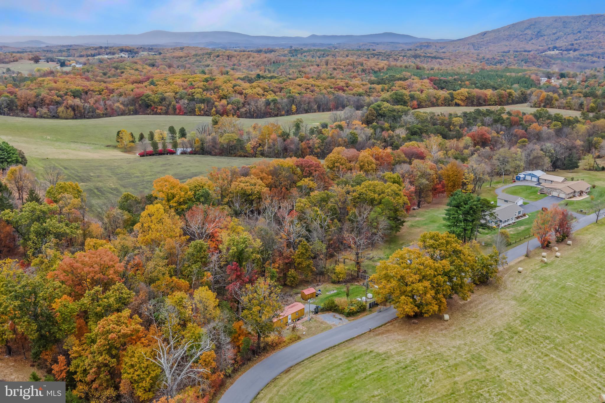 393 Ridersville Road Berkeley Springs, WV 25411 - Photo 27 of 32 an aerial view of a house with a yard