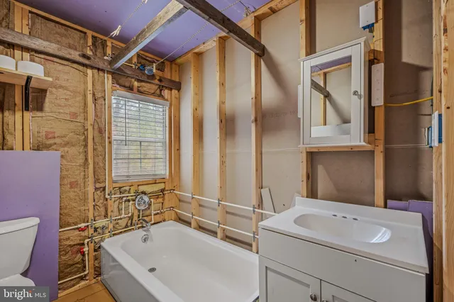 a bathroom with a sink and a bathtub