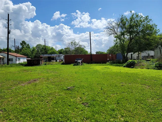 a view of a house with a backyard porch and sitting area